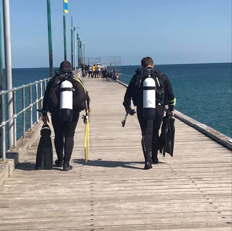 The walk along the jetty to enter the water for a scuba dive near Melbourne, Australia.